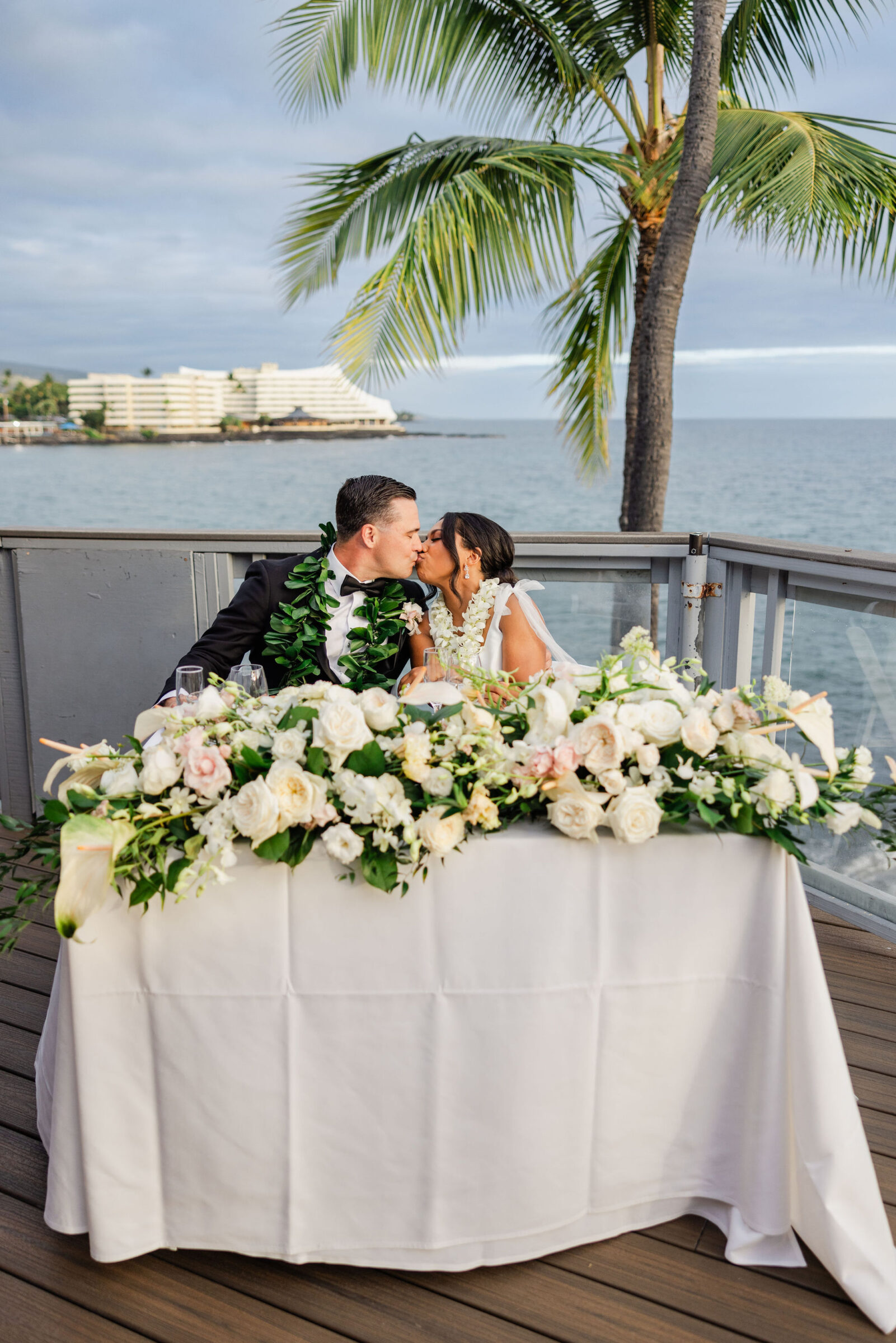 Couple at sweetheart table afer their Big Island Wedding